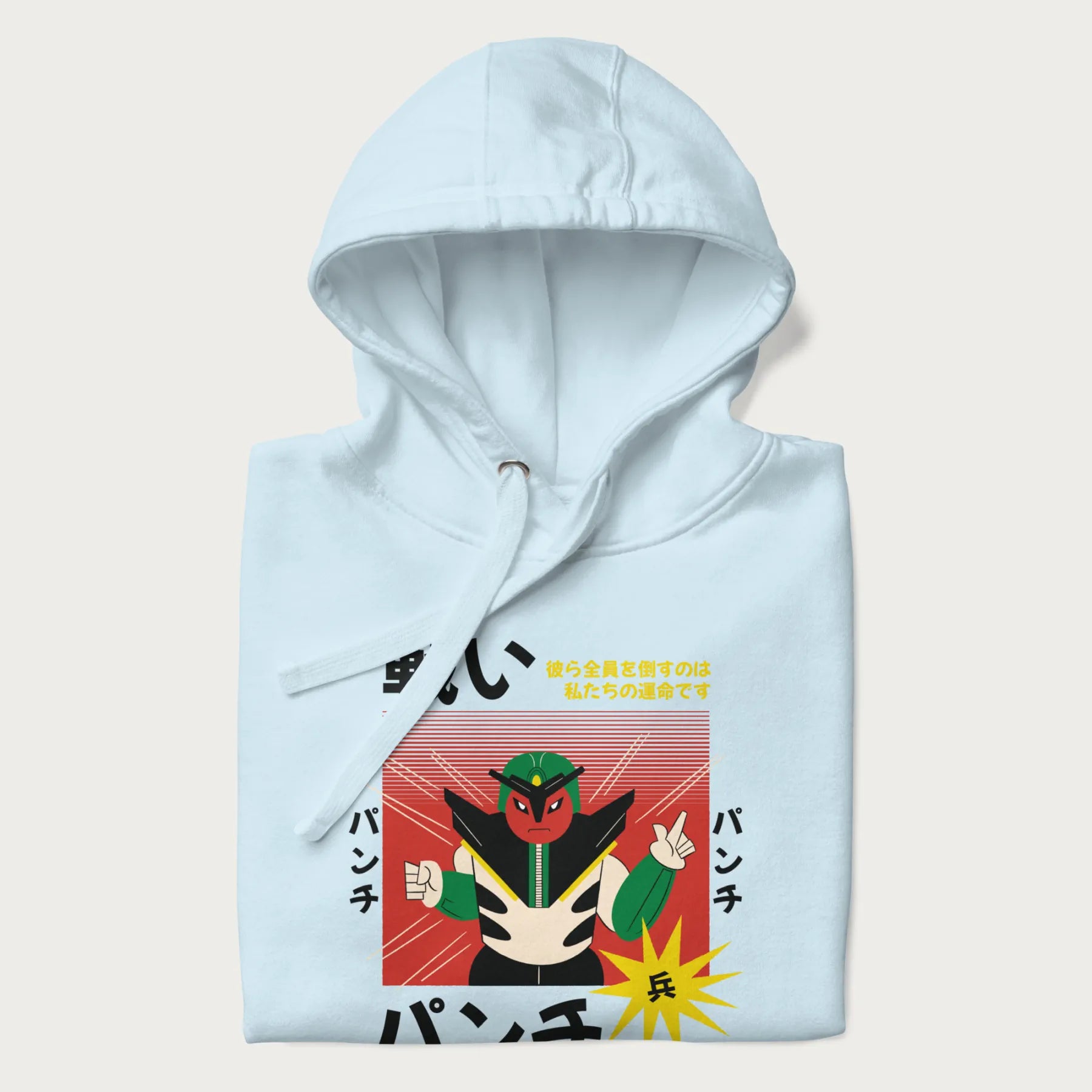 Folded light blue hoodie with Japanese retro graphic of a samurai-inspired robot and Japanese words for "Fight," "Punch," and "Soldier".