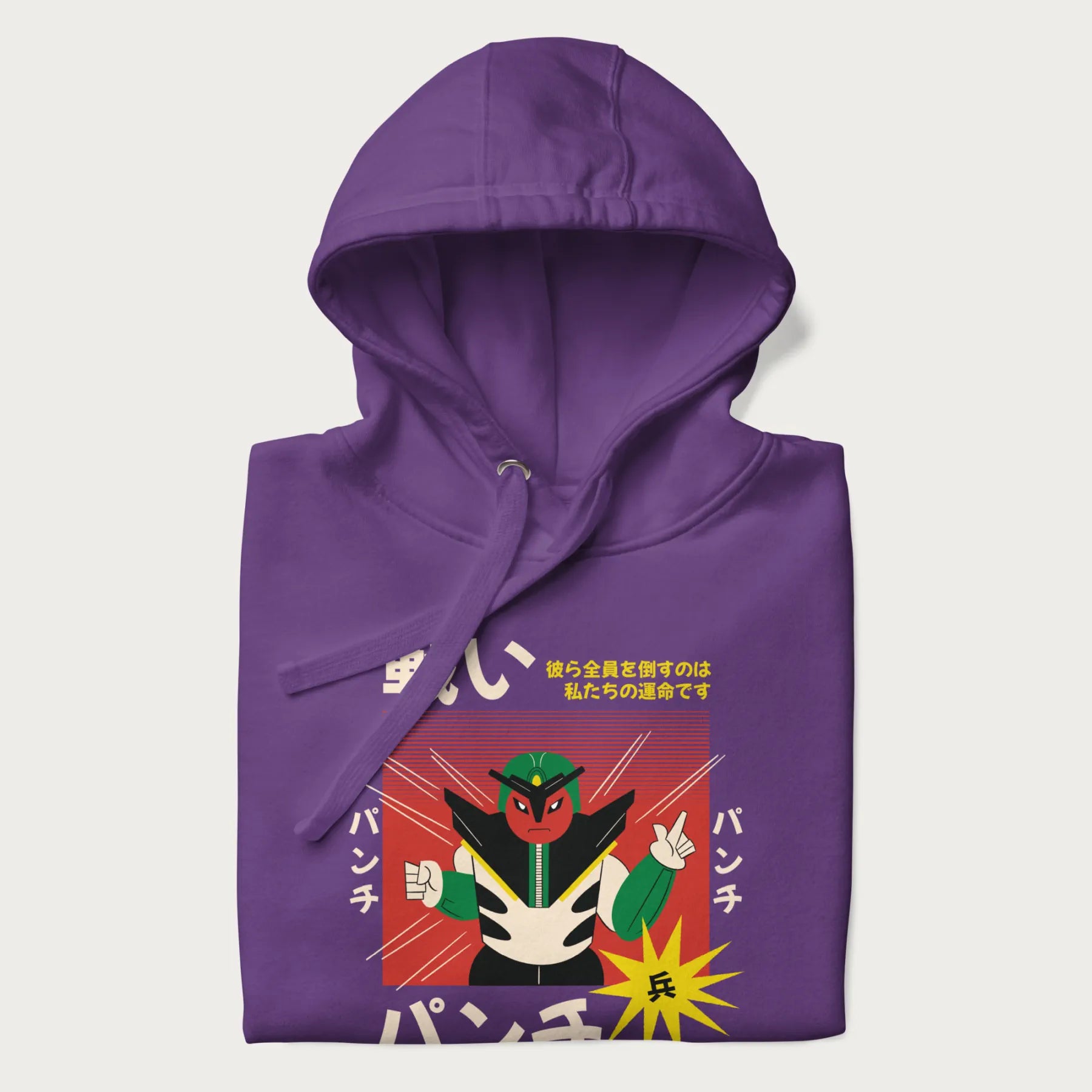 Folded purple hoodie with Japanese retro graphic of a samurai-inspired robot and Japanese words for "Fight," "Punch," and "Soldier".