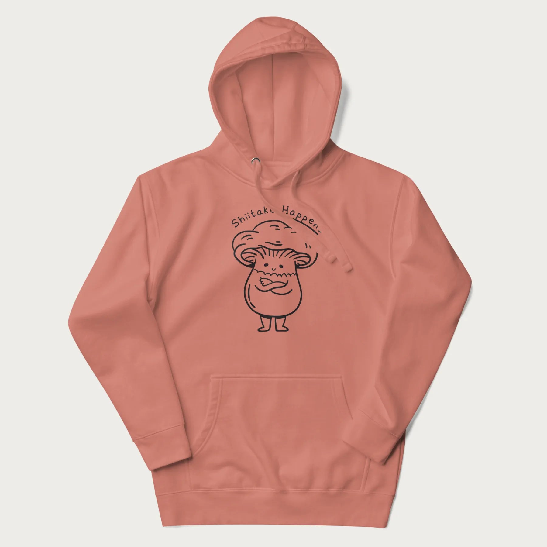 Light pink hoodie featuring a cute shiitake mushroom graphic with the text "Shiitake Happens."