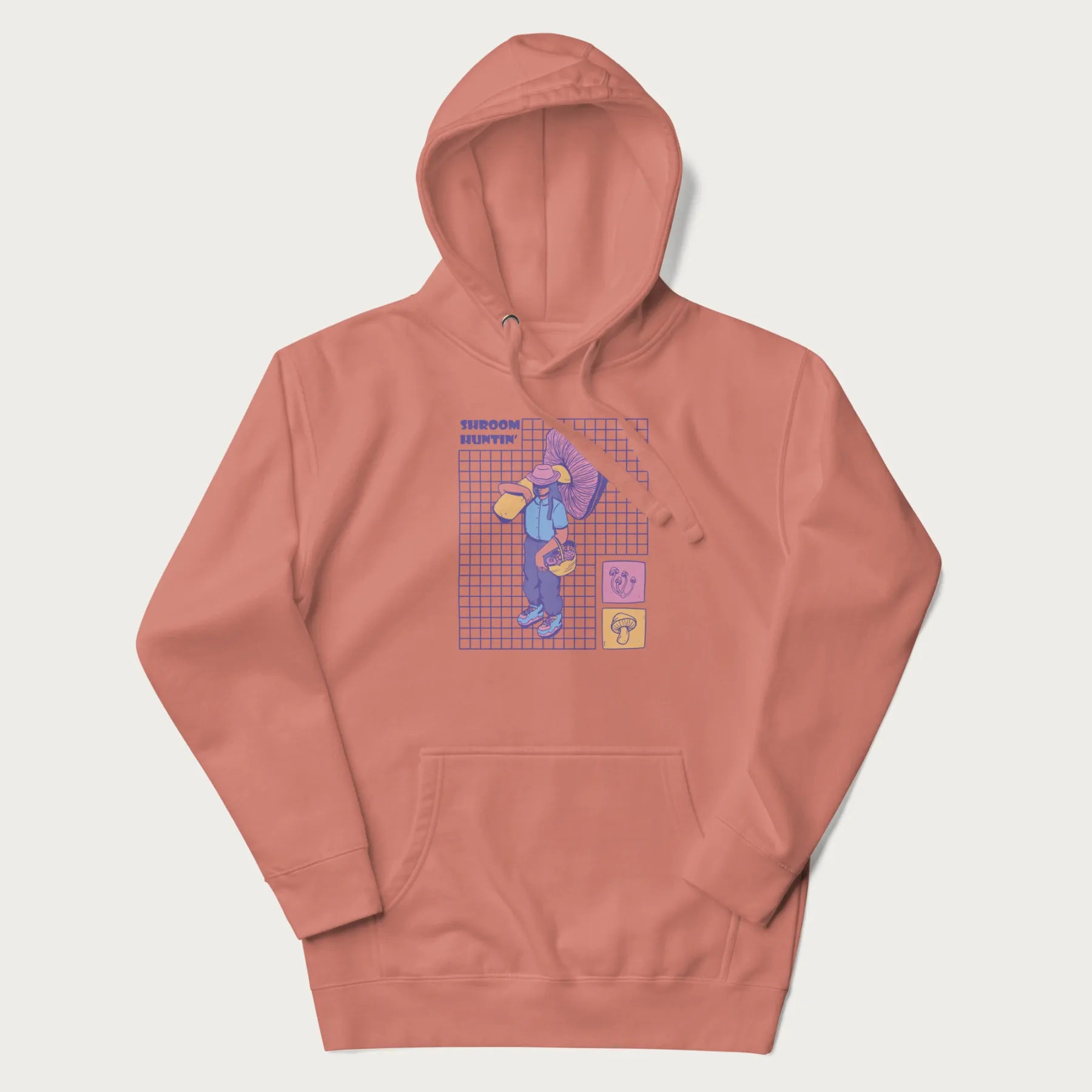 Light pink hoodie featuring a graphic of a girl carrying a large mushroom and a basket of fungi, with the text "Shroom Huntin'".