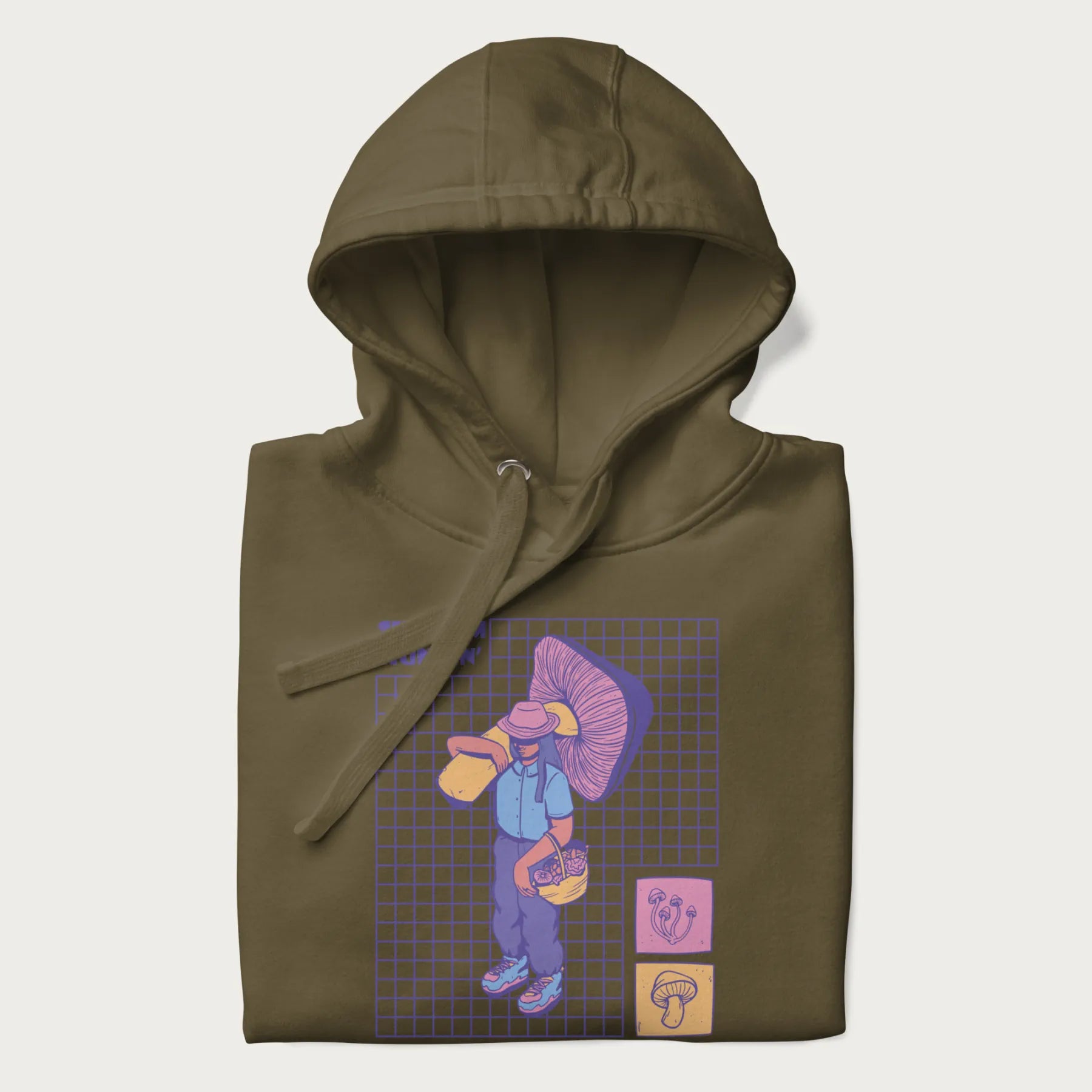 Folded military green hoodie featuring a graphic of a girl carrying a large mushroom and a basket of fungi, with the text "Shroom Huntin'".