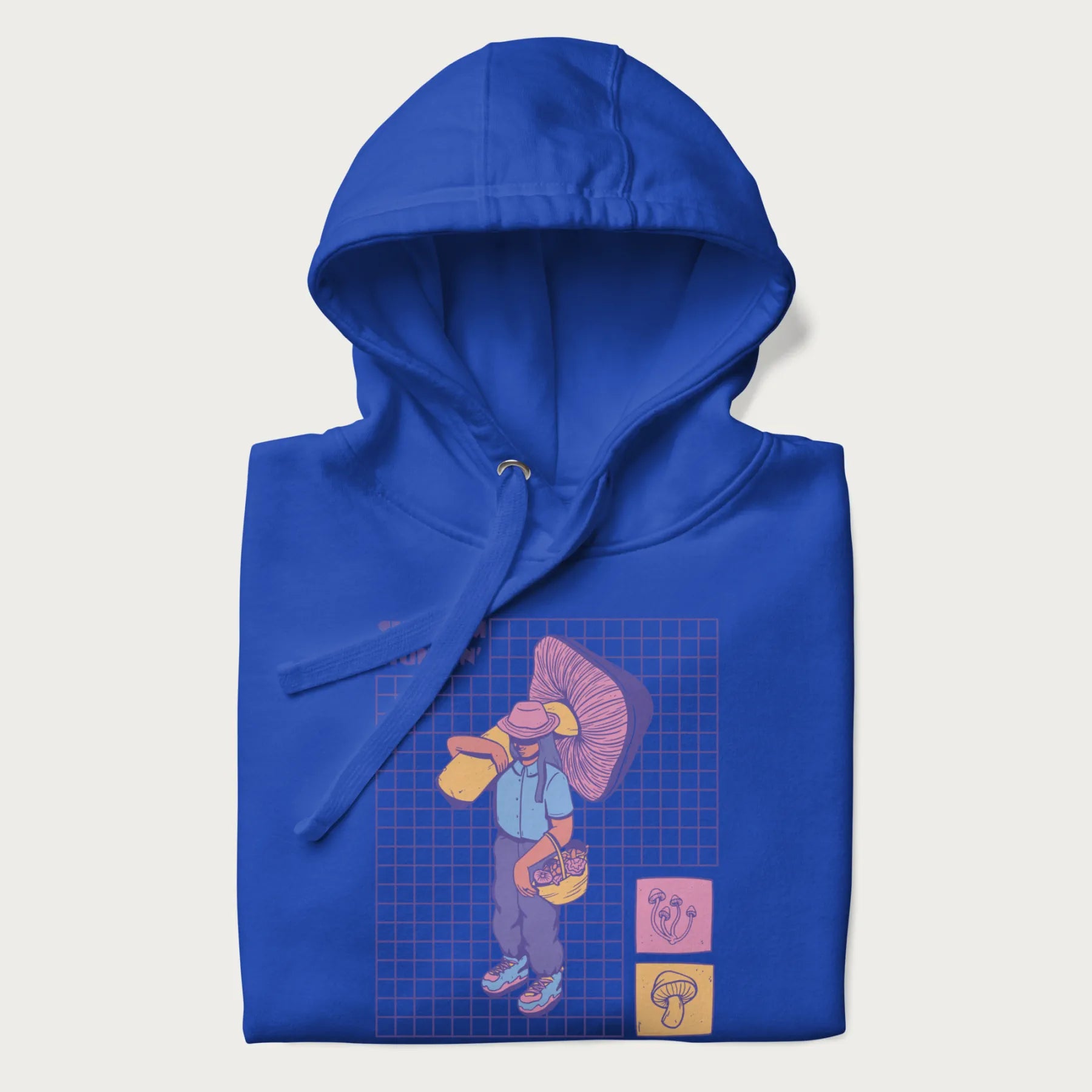 Folded royal blue hoodie featuring a graphic of a girl carrying a large mushroom and a basket of fungi, with the text "Shroom Huntin'".
