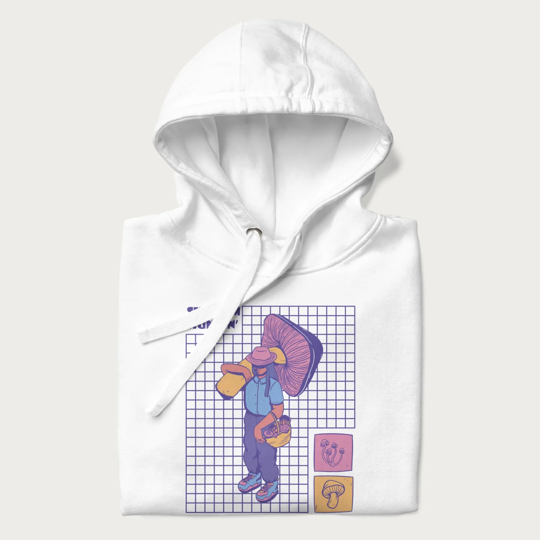 Folded white hoodie featuring a graphic of a girl carrying a large mushroom and a basket of fungi, with the text "Shroom Huntin'".
