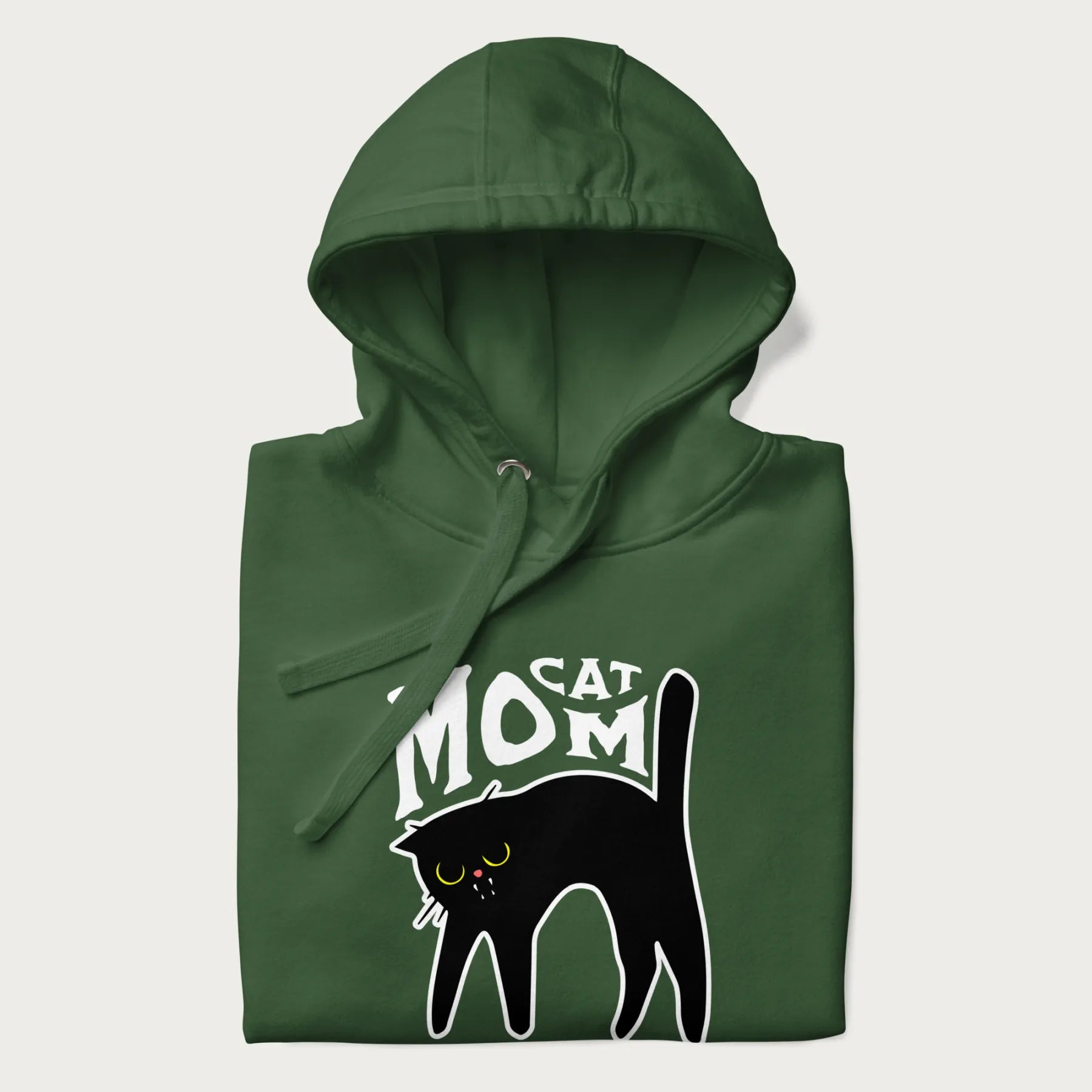 Folded forest green hoodie with 'Cat Mom' in white lettering above a minimalistic graphic of a black cat with yellow eyes.