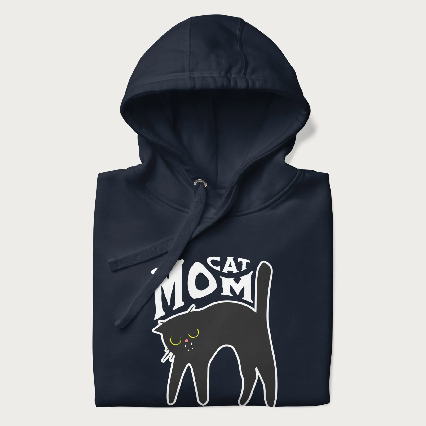 Folded navy blue hoodie with 'Cat Mom' in white lettering above a minimalistic graphic of a black cat with yellow eyes.