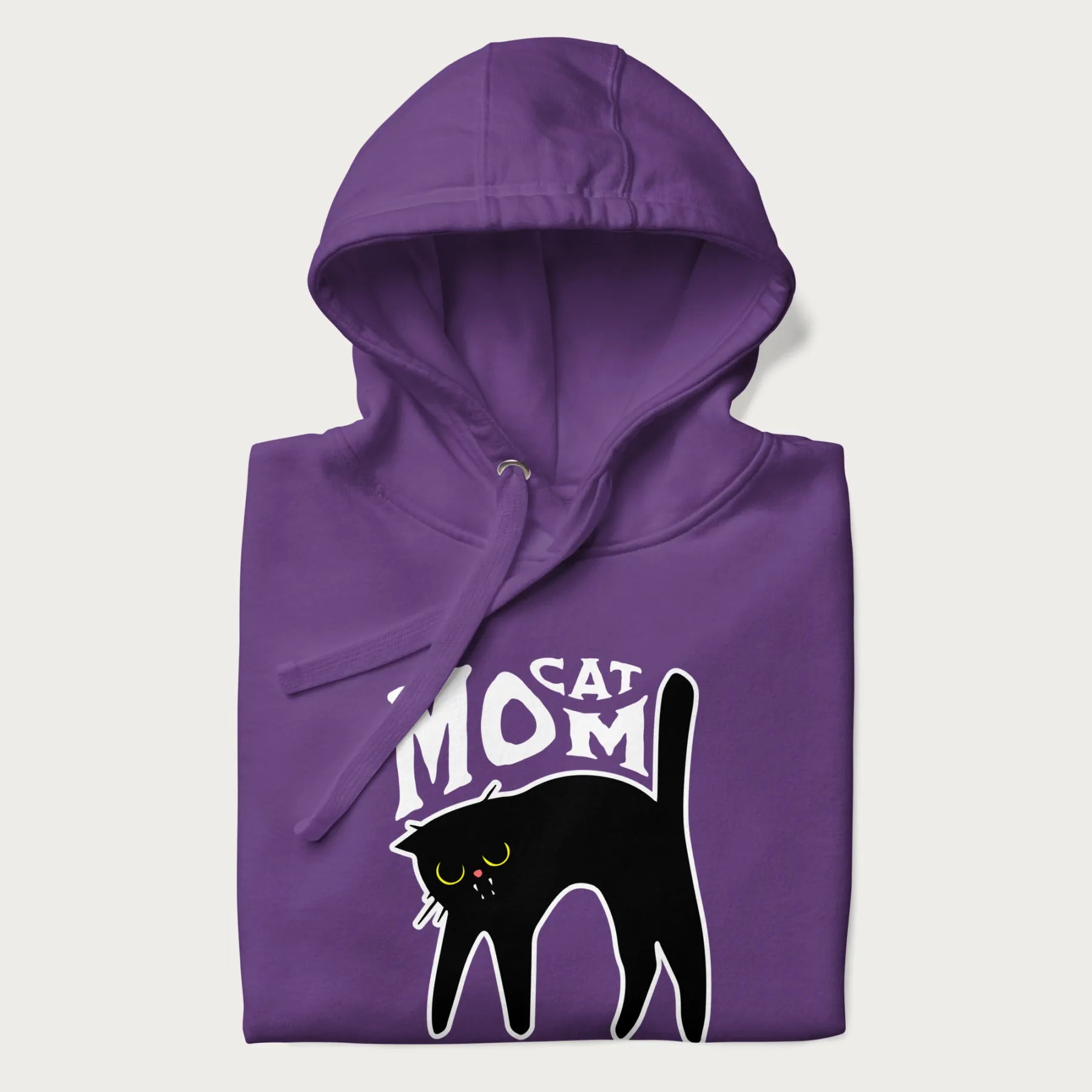 Folded purple hoodie with 'Cat Mom' in white lettering above a minimalistic graphic of a black cat with yellow eyes.