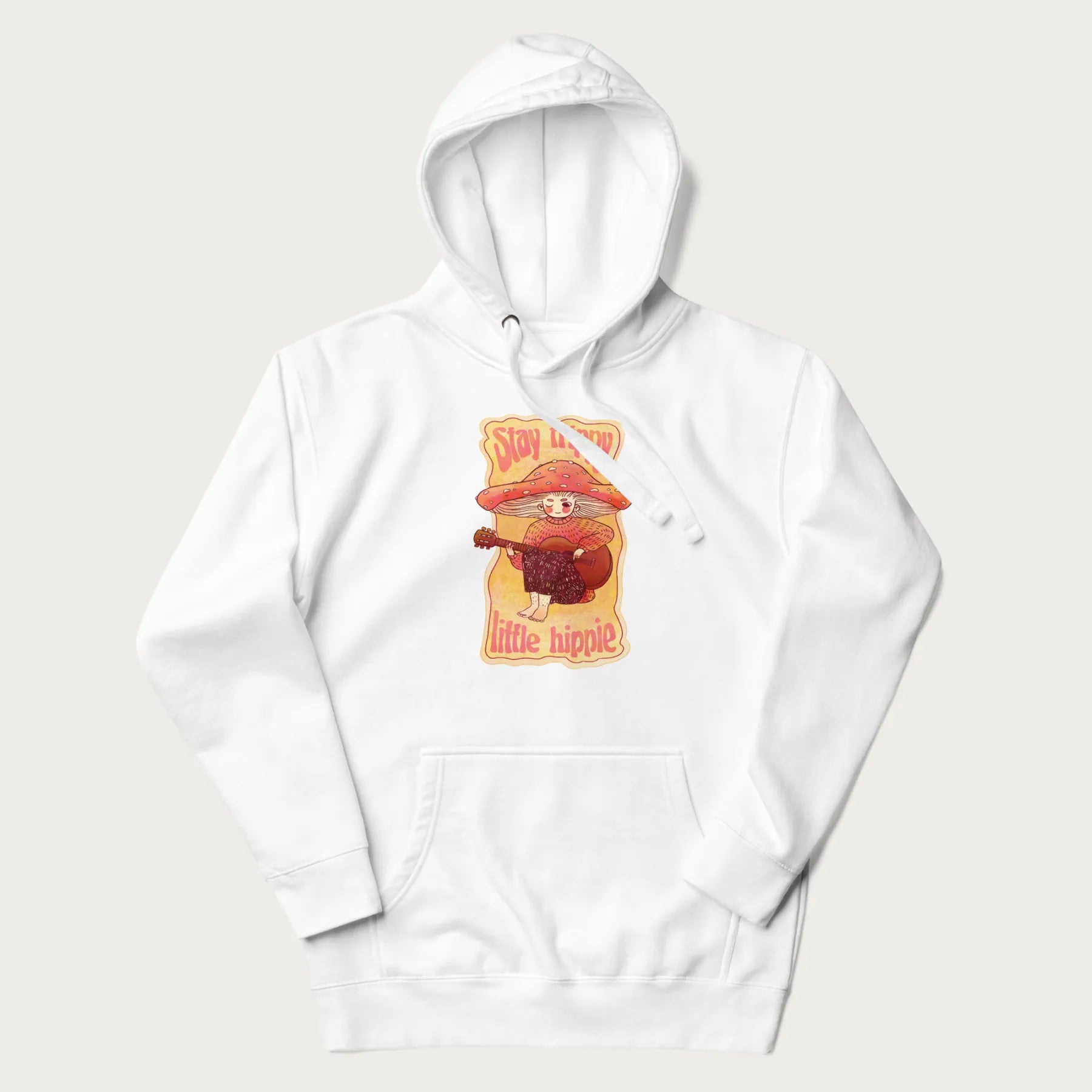 White hoodie with a graphic of a character with a mushroom cap playing a guitar and the text 'Stay Trippy Little Hippie.'
