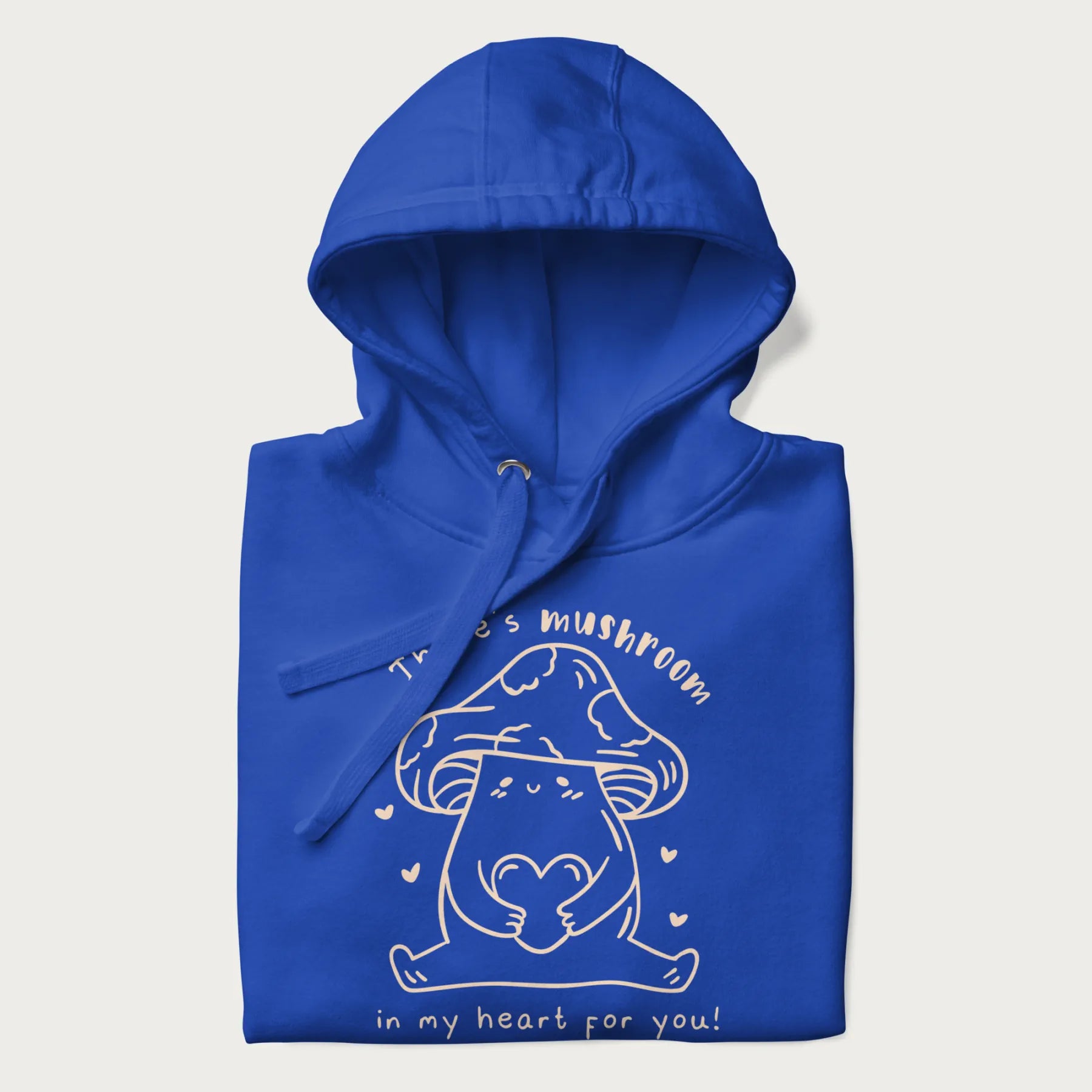 Folded royal blue hoodie with graphic of a cute mushroom holding a heart with the text "There's Mushroom in My Heart for You!"