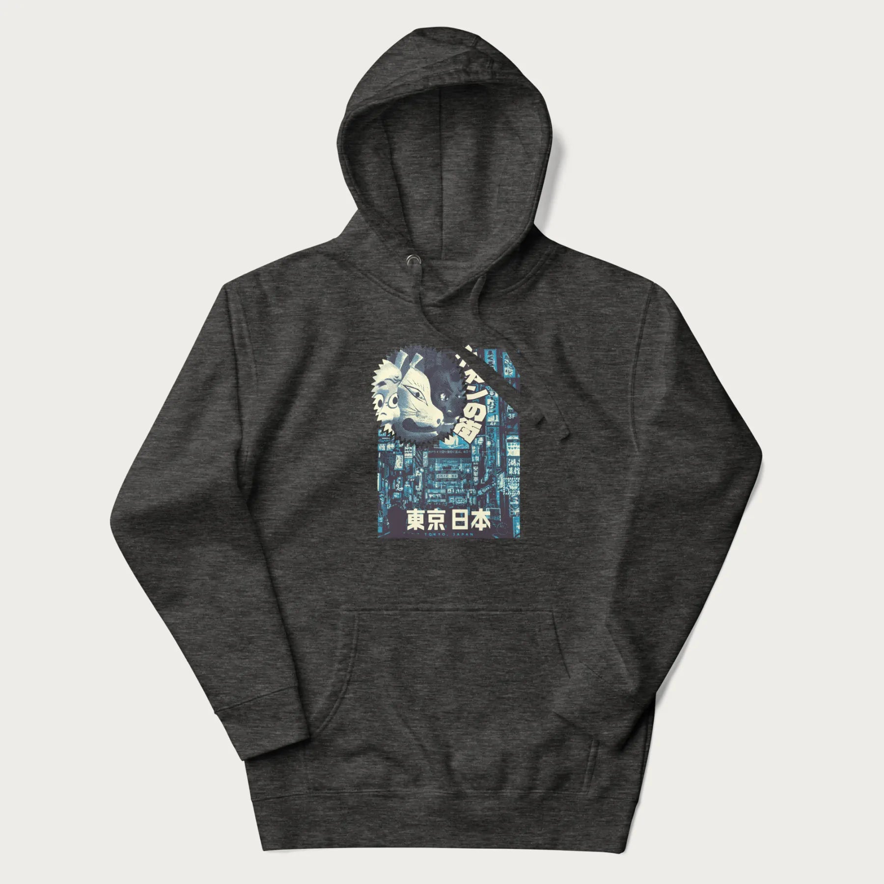 Dark grey hoodie with Japanese text '東京日本' translating to 'Tokyo, Japan', with three traditional Japanese masks over a neon-lit Tokyo background.