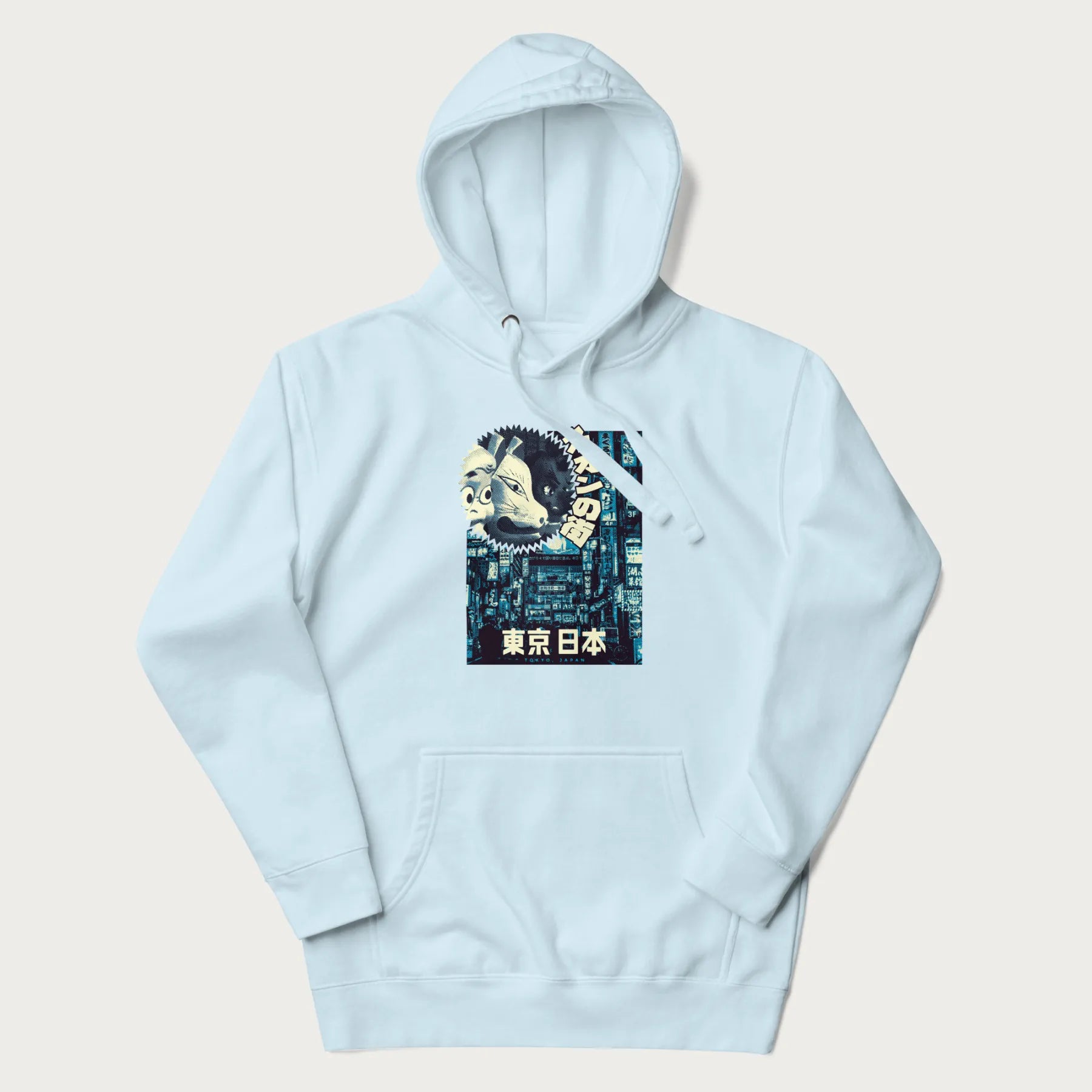 Light blue hoodie with Japanese text '東京日本' translating to 'Tokyo, Japan', with three traditional Japanese masks over a neon-lit Tokyo background.