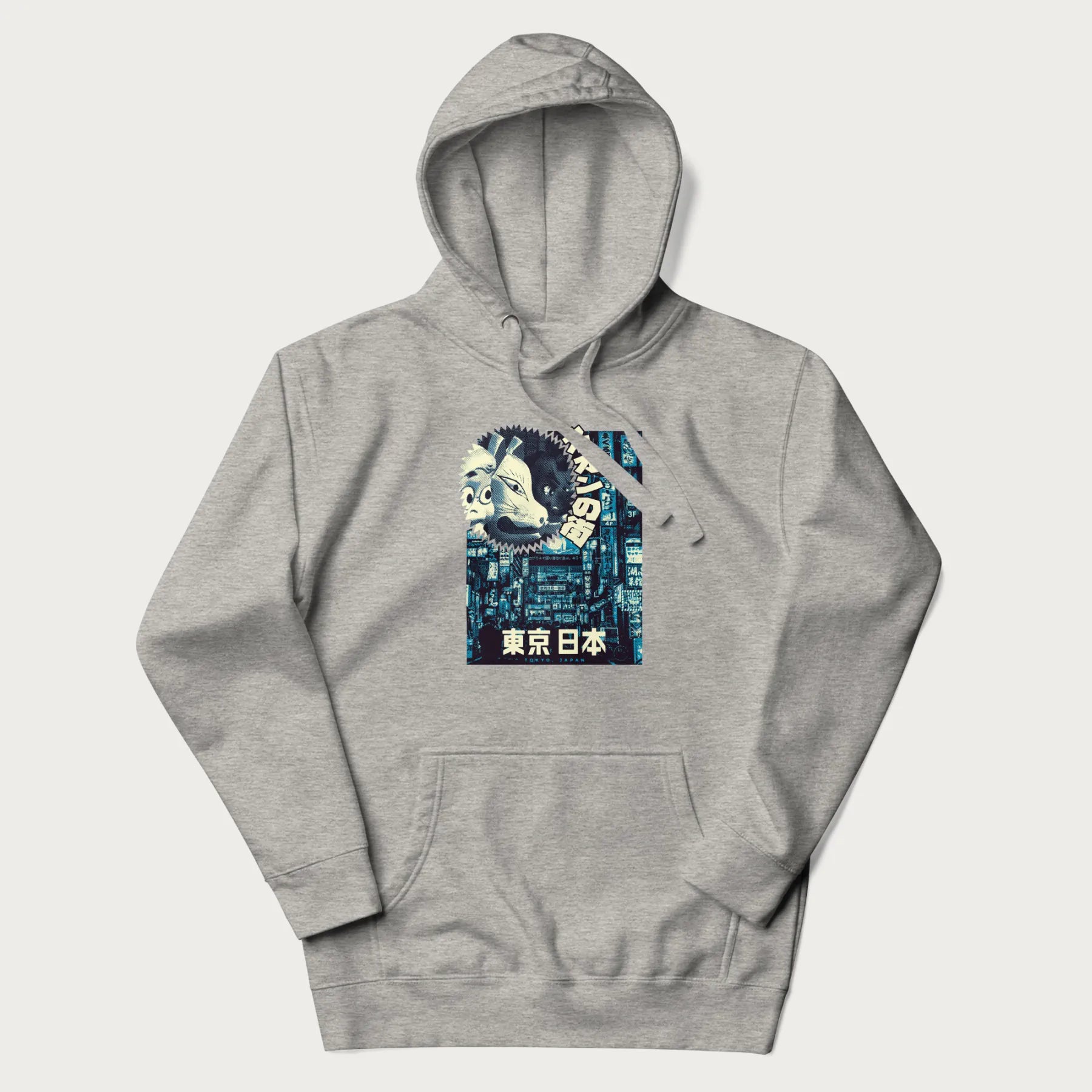 Light grey hoodie with Japanese text '東京日本' translating to 'Tokyo, Japan', with three traditional Japanese masks over a neon-lit Tokyo background.