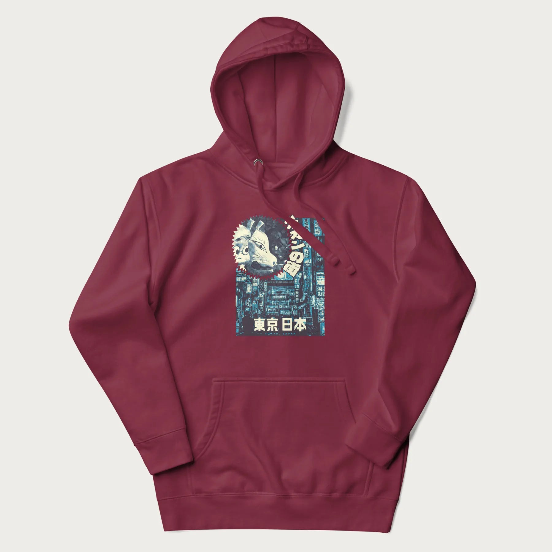 Maroon hoodie with Japanese text '東京日本' translating to 'Tokyo, Japan', with three traditional Japanese masks over a neon-lit Tokyo background.
