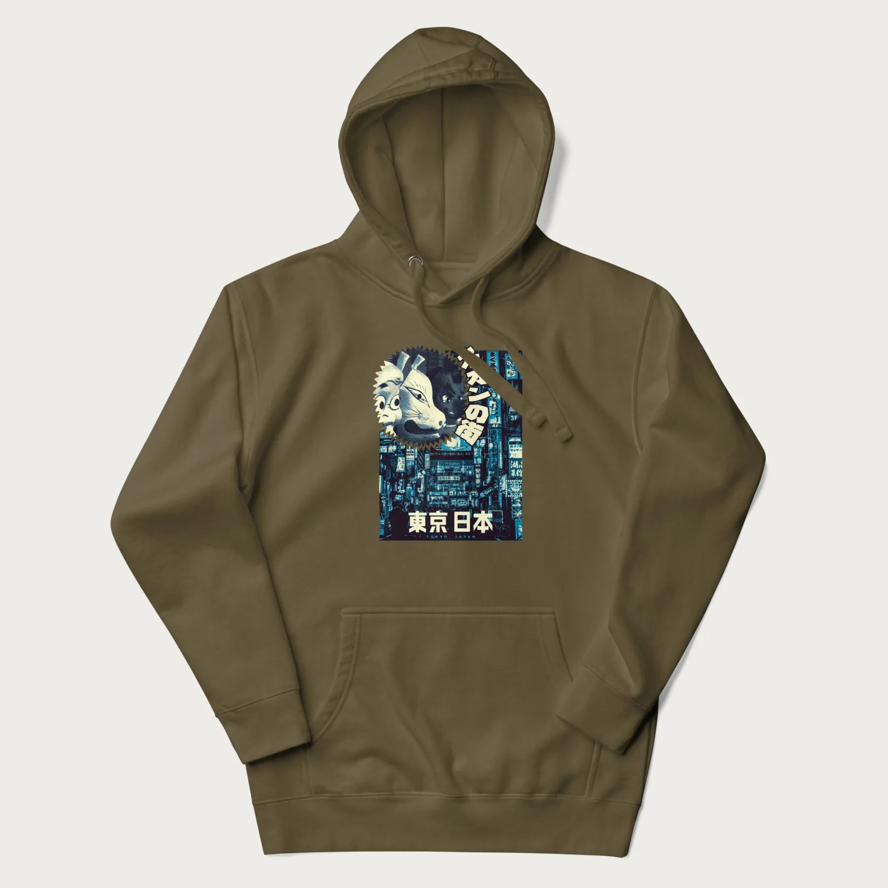 Military green hoodie with Japanese text '東京日本' translating to 'Tokyo, Japan', with three traditional Japanese masks over a neon-lit Tokyo background.