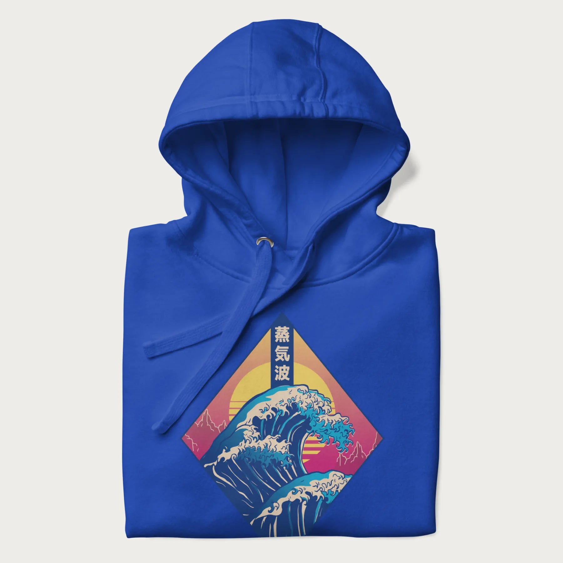 Folded royal blue hoodie with Japanese 'Great Wave' graphic print in vaporwave style, rendered in bright, psychedelic colors in diamond-shaped layout.