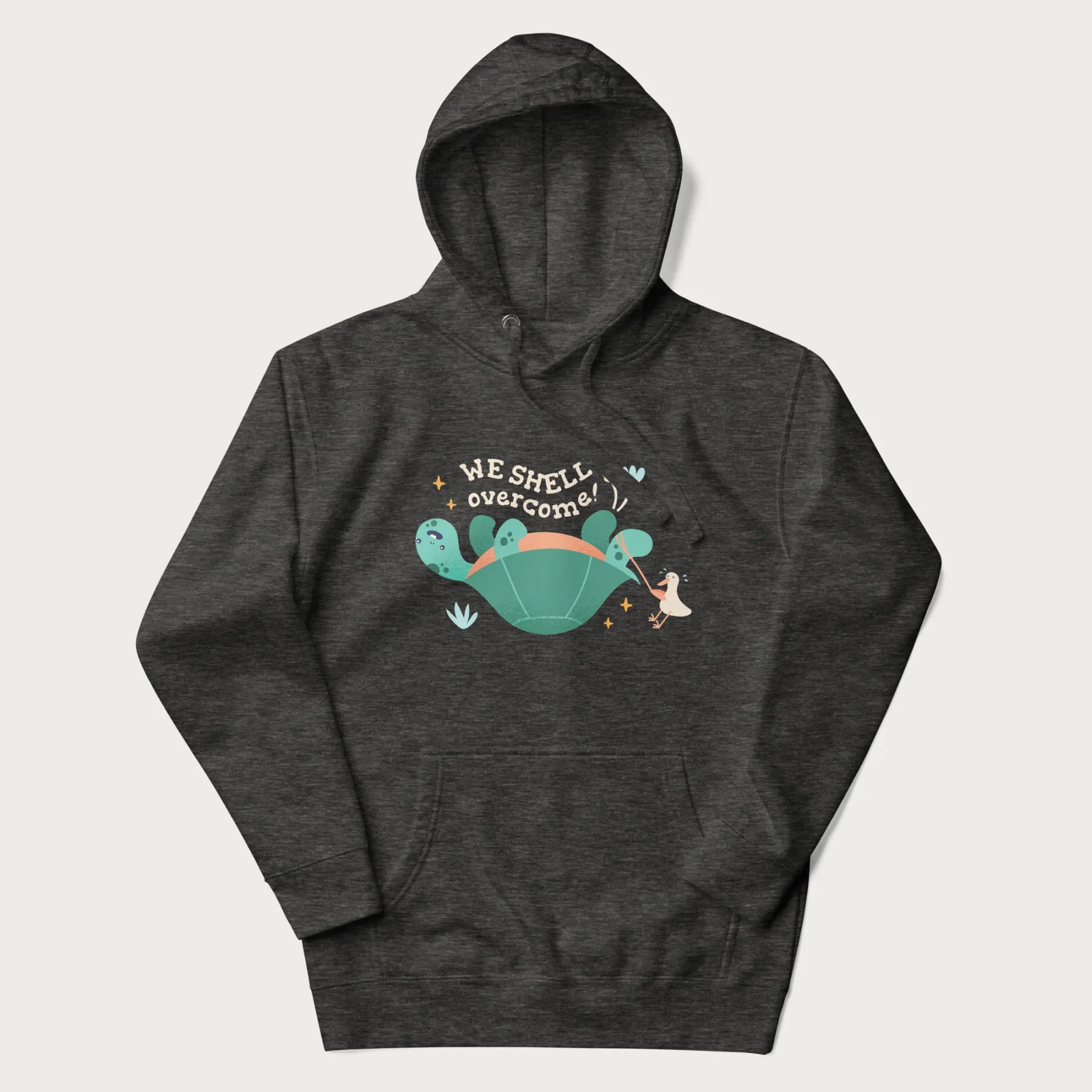 Dark grey hoodie with graphic of a turtle and a duck with the text 'We Shell Overcome'.