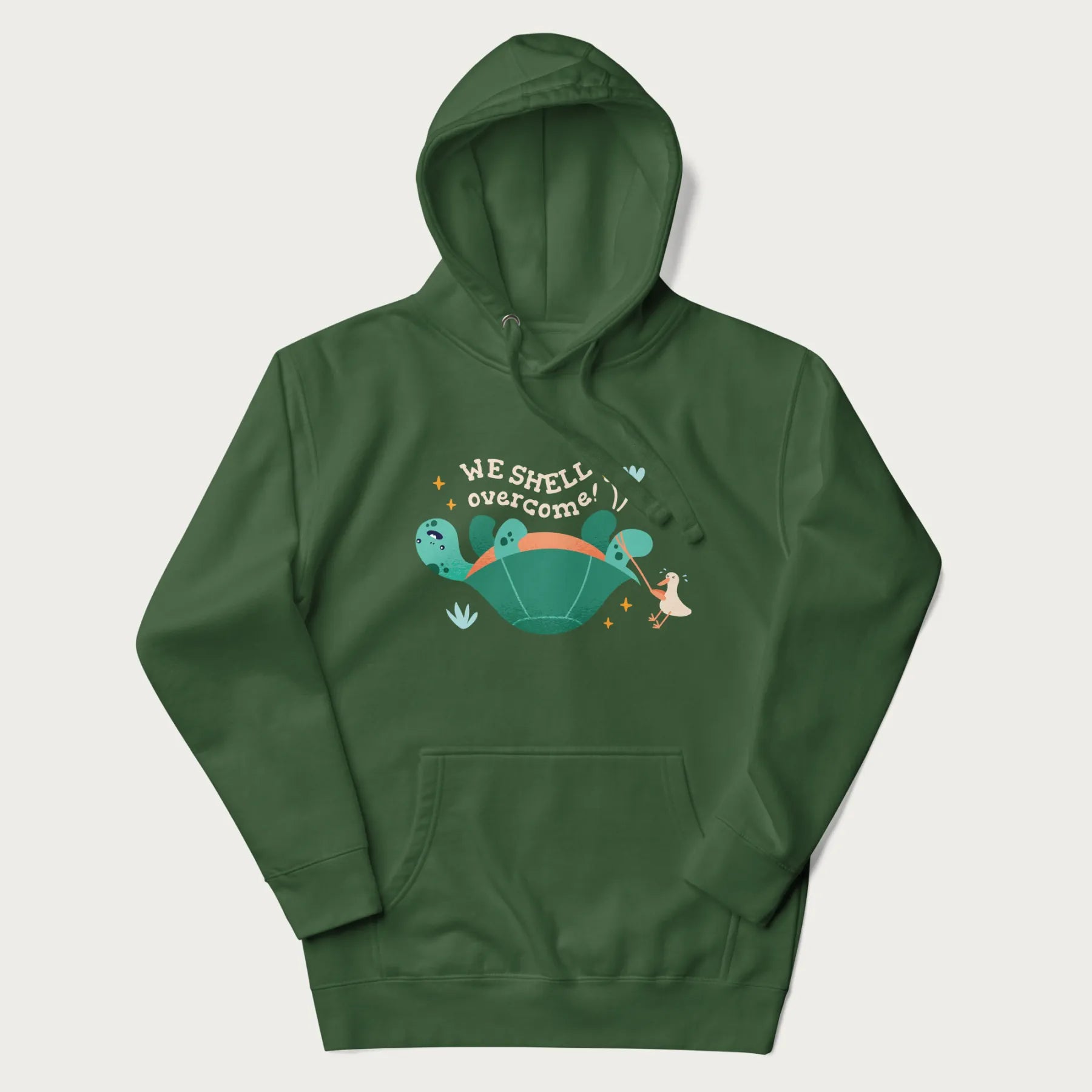Forest green hoodie with graphic of a turtle and a duck with the text 'We Shell Overcome'.