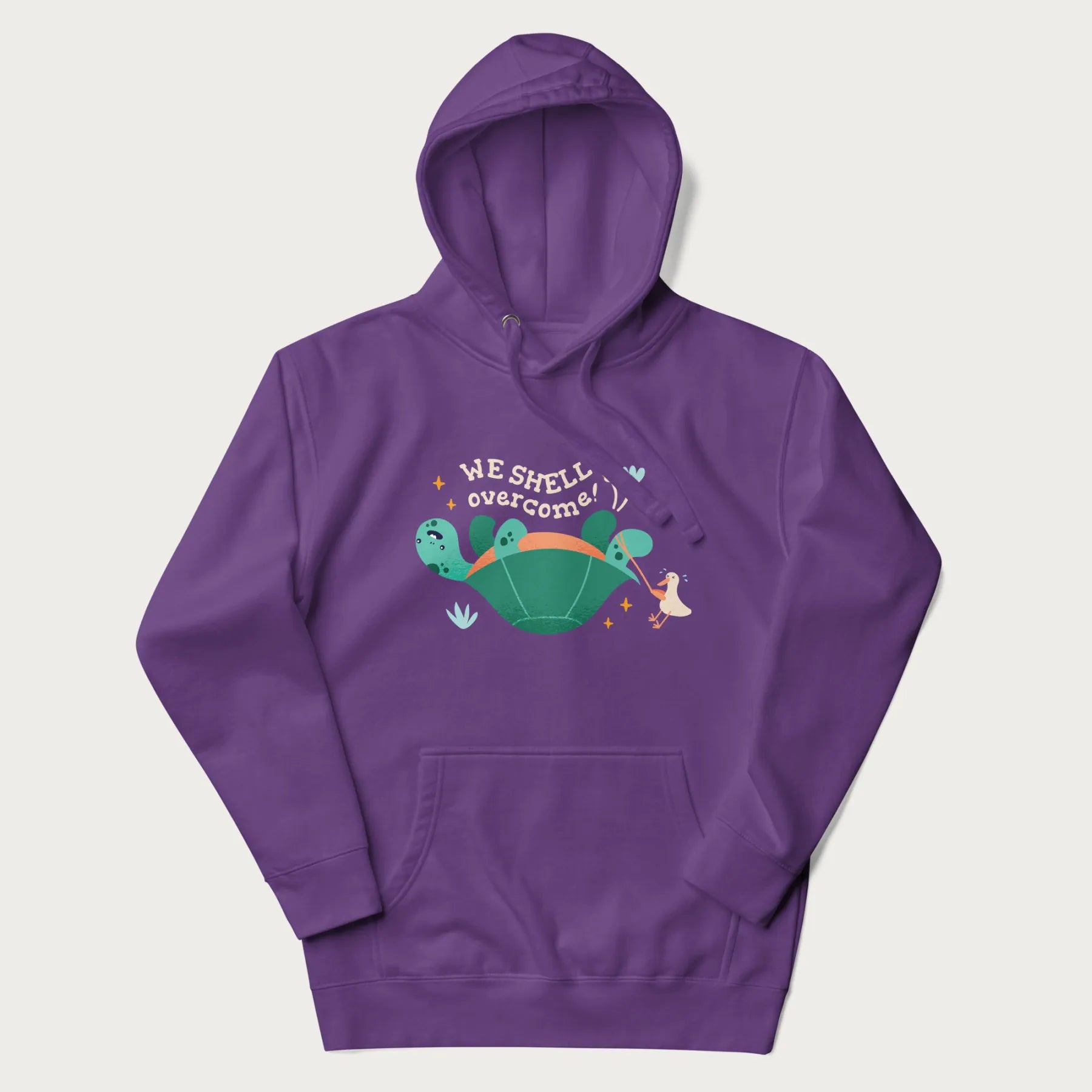 Purple hoodie with graphic of a turtle and a duck with the text 'We Shell Overcome'.