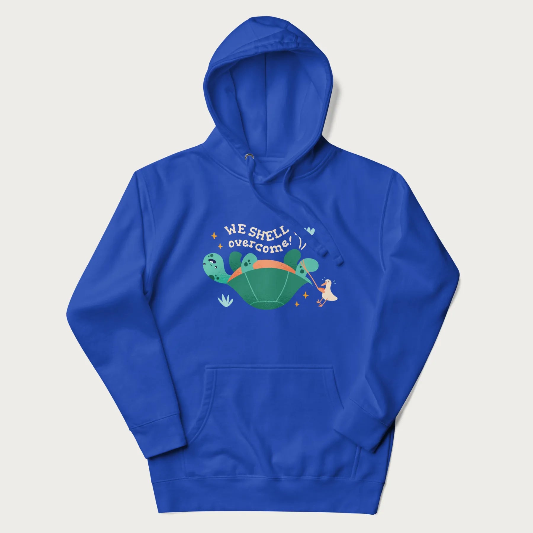 Royal blue hoodie with graphic of a turtle and a duck with the text 'We Shell Overcome'.