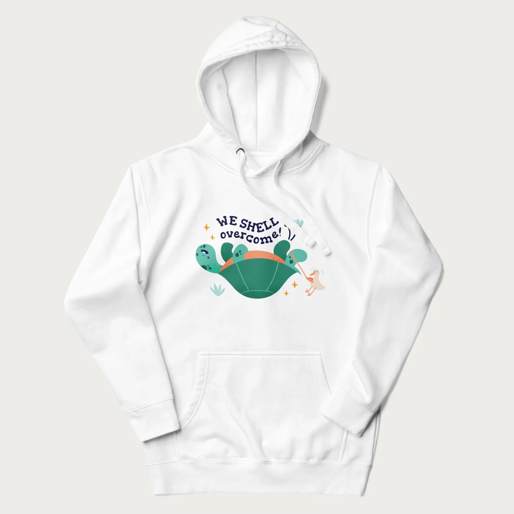 White hoodie with graphic of a turtle and a duck with the text 'We Shell Overcome'.