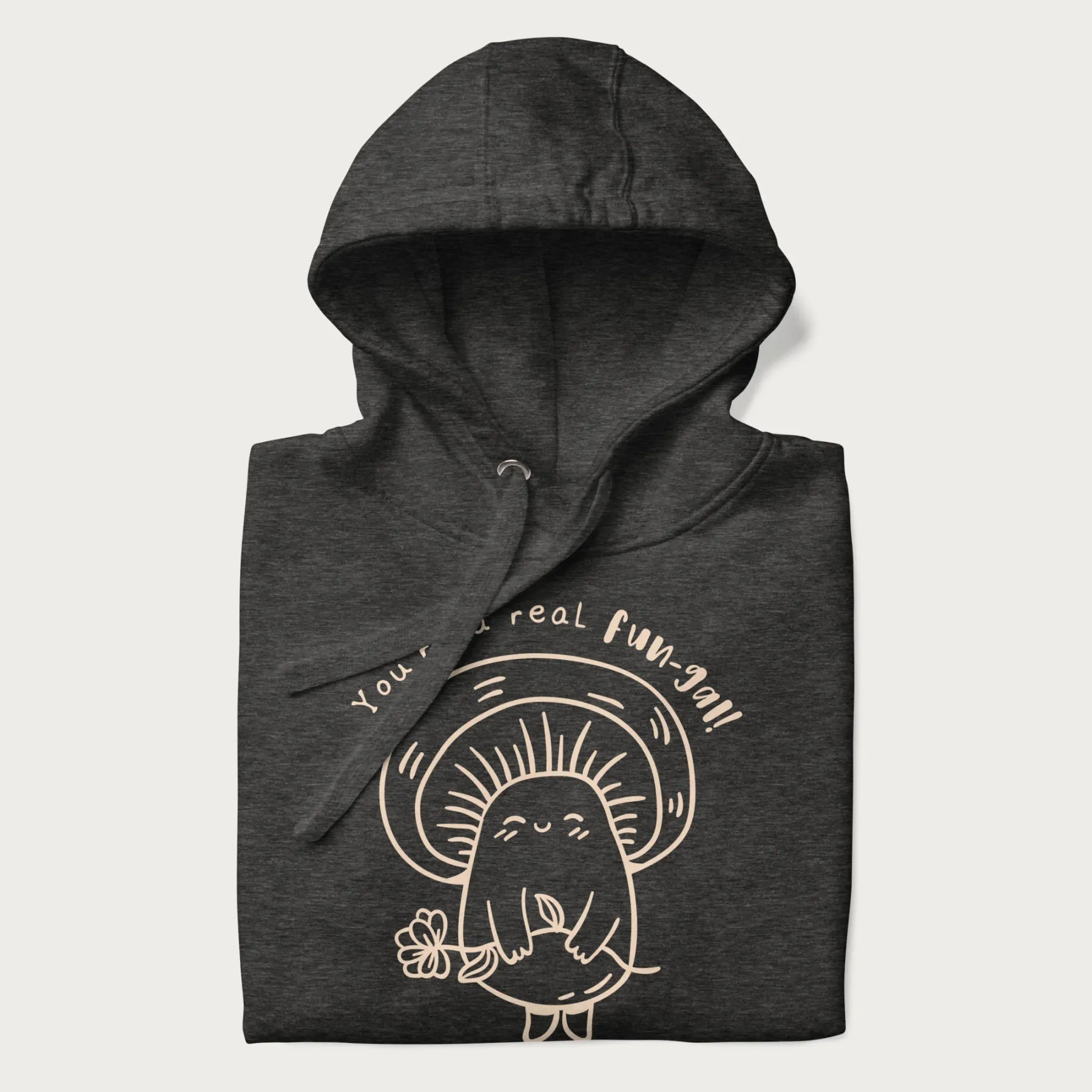Folded dark grey hoodie with graphic of a cute mushroom holding a flower and the text "You're a Real Fun-gal!"