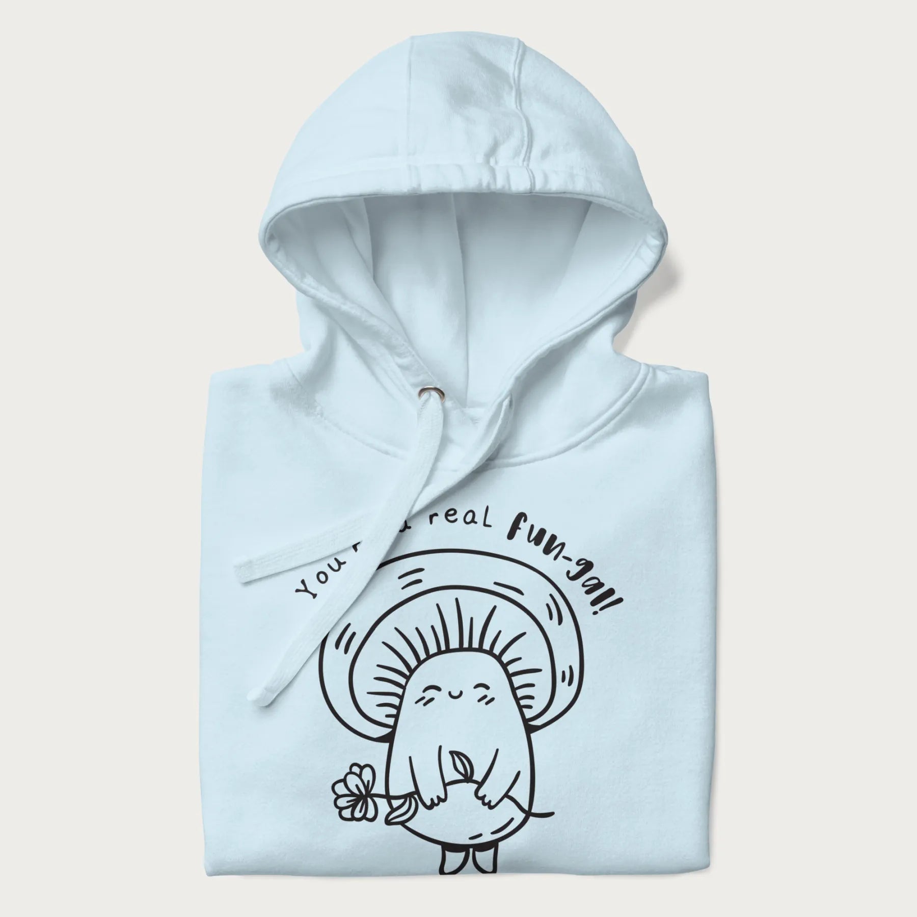 Folded light blue hoodie with graphic of a cute mushroom holding a flower and the text "You're a Real Fun-gal!"