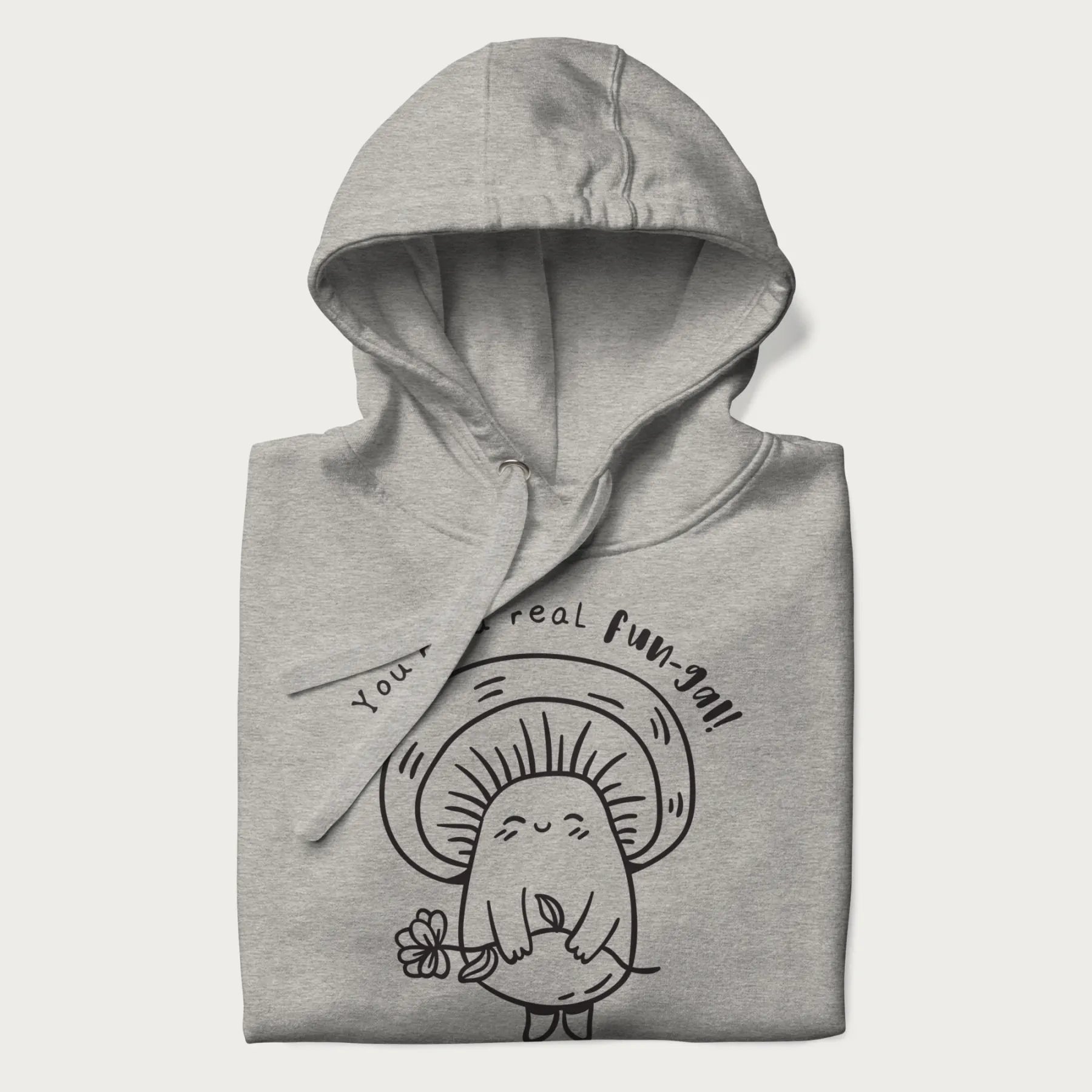Folded light grey hoodie with graphic of a cute mushroom holding a flower and the text "You're a Real Fun-gal!"