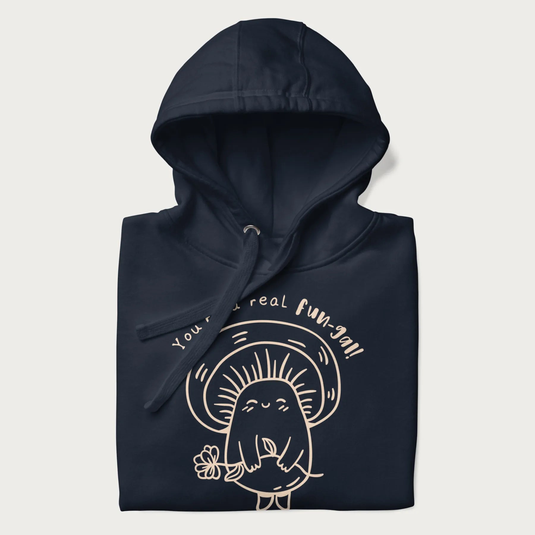 Folded navy blue hoodie with graphic of a cute mushroom holding a flower and the text "You're a Real Fun-gal!"