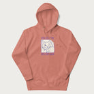 Light pink hoodie with graphic of a winking cat with the text "80% cotton 20% cat hair".
