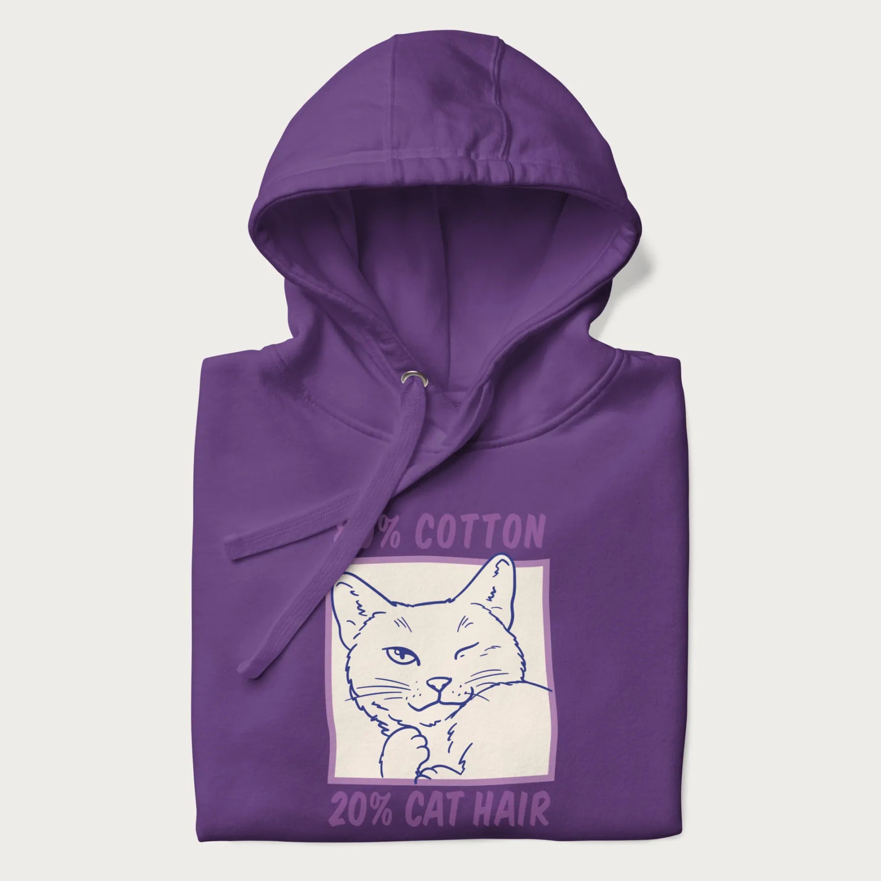 Folded purple hoodie with graphic of a winking cat with the text "80% cotton 20% cat hair".