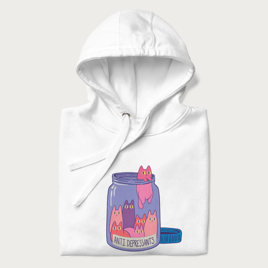 Cartoon cats in a clear jar labeled 'Anti Depressants' printed on a folded white hoodie.