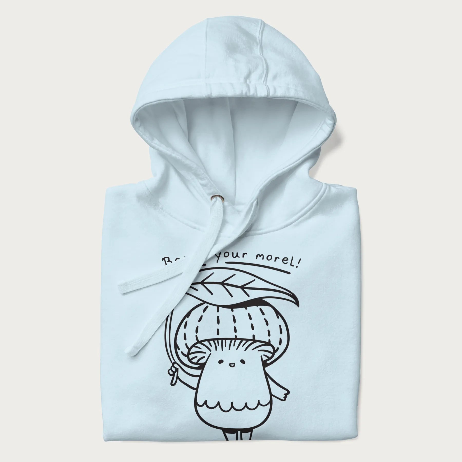 Folded light blue hoodie with graphic of a cute mushroom holding a leaf with the text "Boost Your Morel."