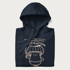 Folded navy blue hoodie with graphic of a cute mushroom holding a leaf with the text "Boost Your Morel."