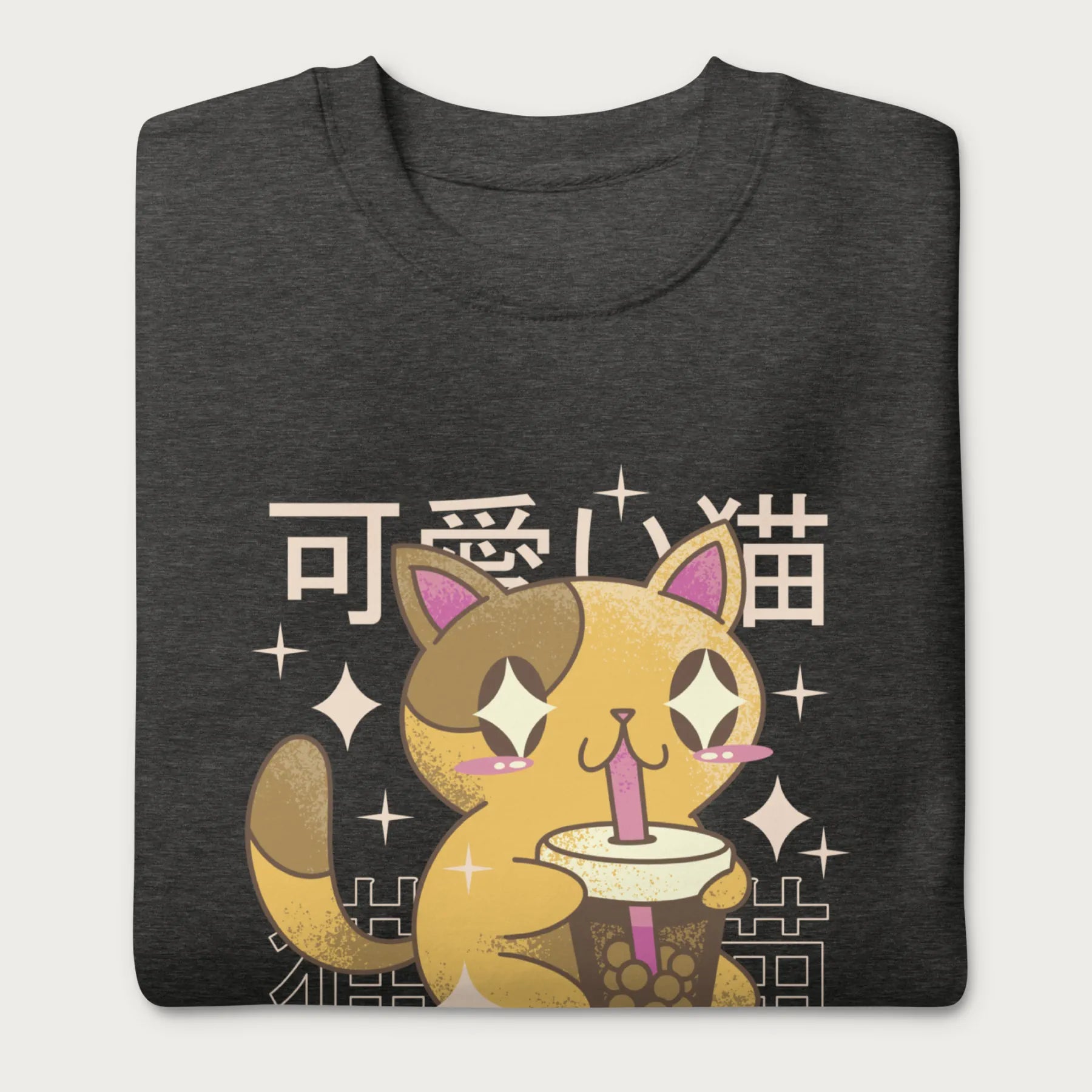 Folded dark grey sweatshirt with Japanese text and a kawaii graphic of a cat drinking bubble tea.