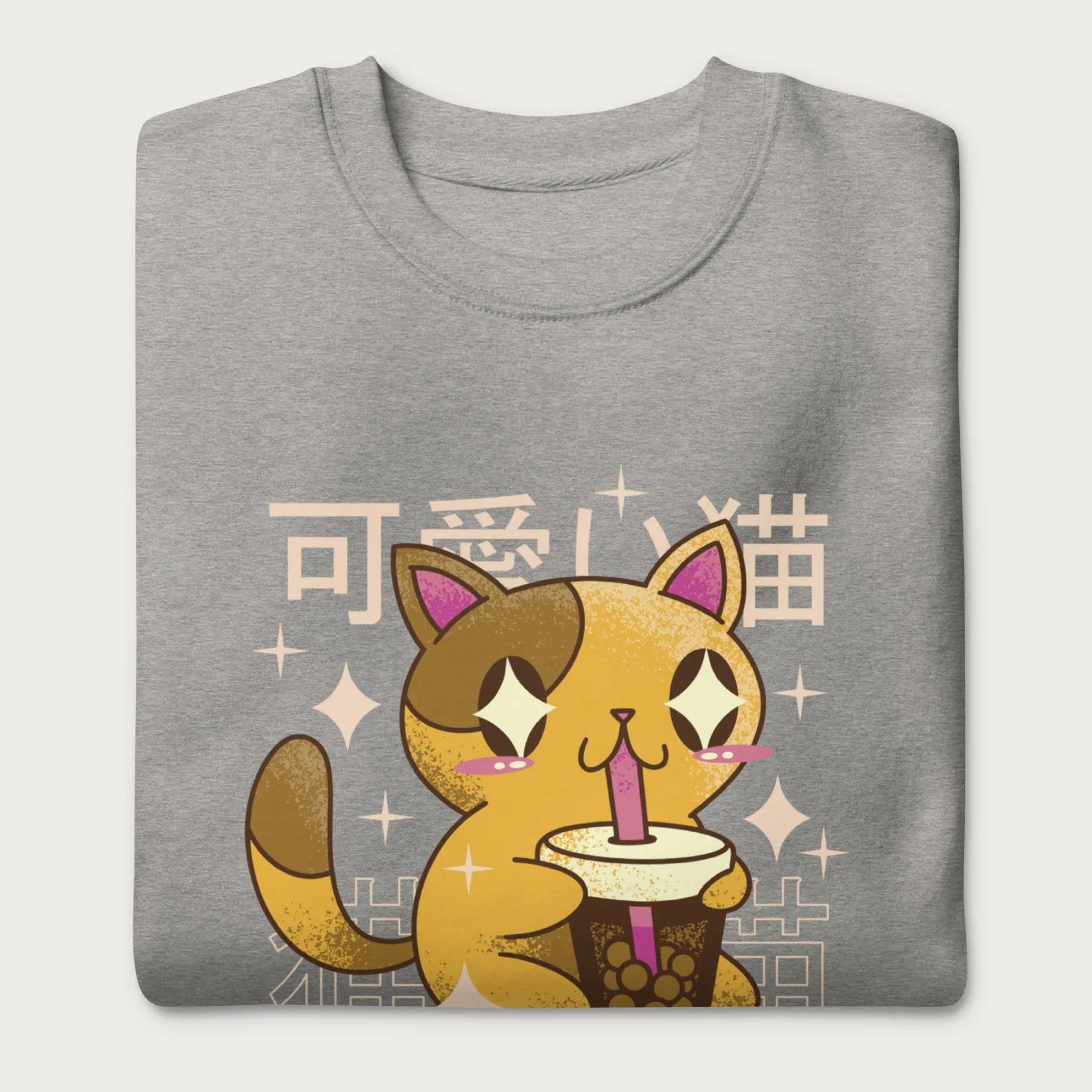 Folded light grey sweatshirt with Japanese text and a kawaii graphic of a cat drinking bubble tea.