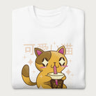 Folded white sweatshirt with Japanese text and a kawaii graphic of a cat drinking bubble tea.