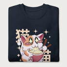 Folded navy blue sweatshirt with Japanese text and a graphic of a kawaii cat eating ramen.