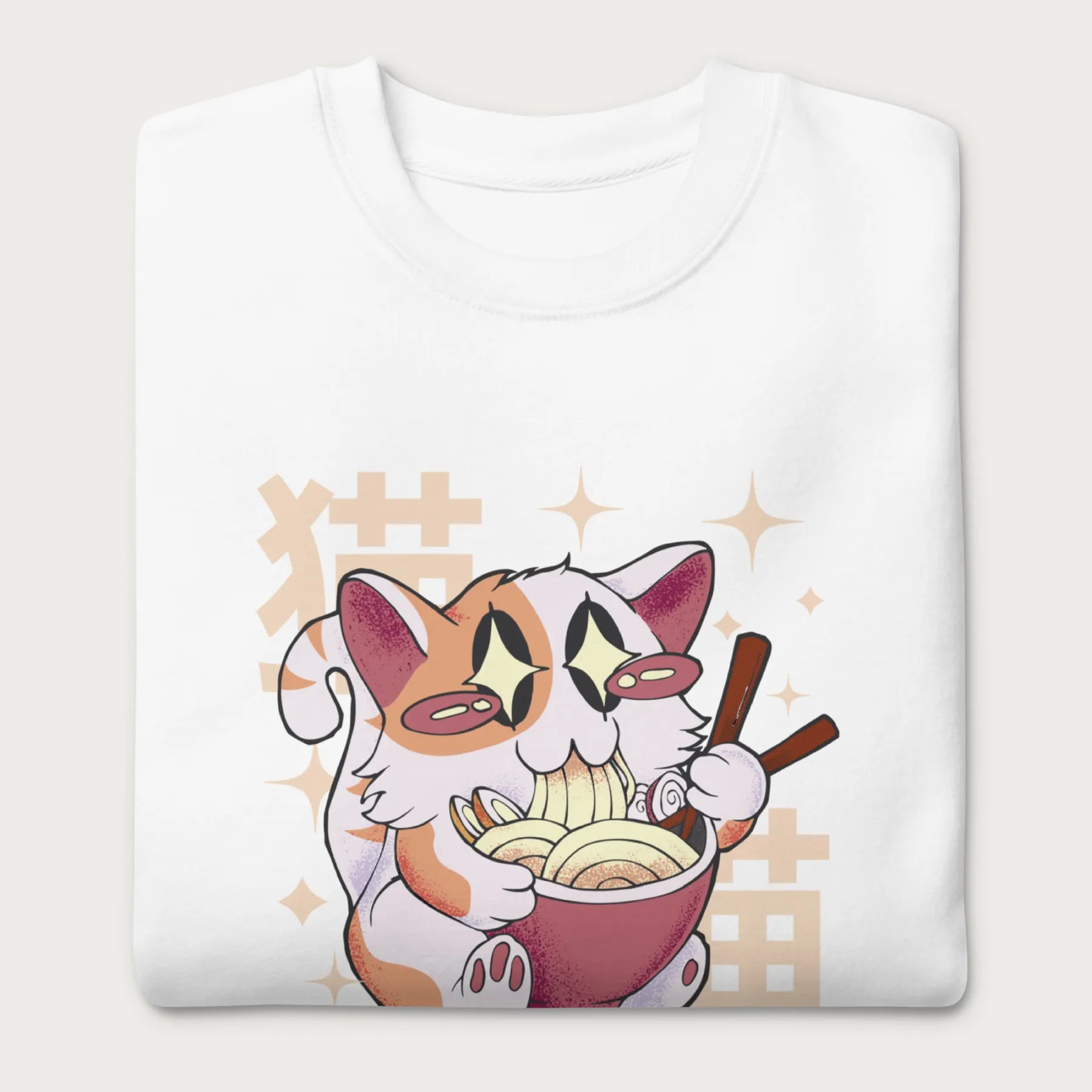 Folded white sweatshirt with Japanese text and a graphic of a kawaii cat eating ramen.