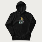 Black hoodie with graphic of a tabby cat on a scratching post, raising its middle finger.