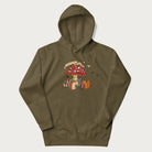 Military green hoodie with animal around a festively decorated mushroom and the text 'Christmas with the Beloved' above.