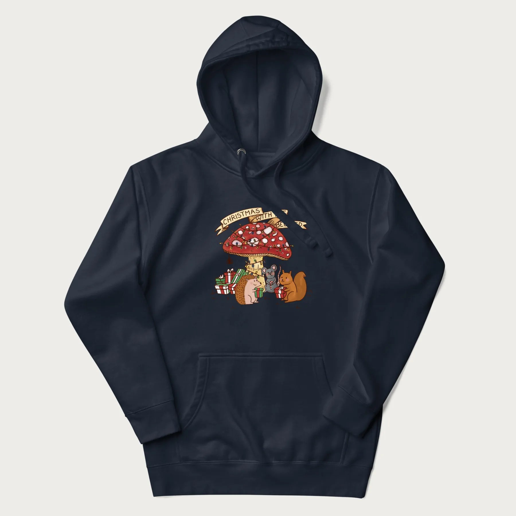 Navy blue hoodie with animal around a festively decorated mushroom and the text 'Christmas with the Beloved' above.