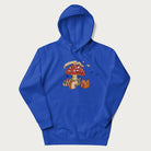 Royal blue hoodie with animal around a festively decorated mushroom and the text 'Christmas with the Beloved' above.