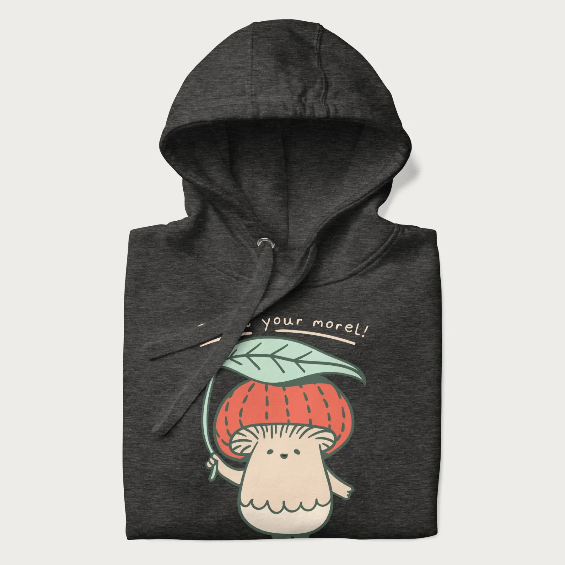 Folded dark grey hoodie with a graphic of an adorable mushroom character with a red cap and the text 'Boost your morel!'.