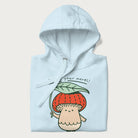 Folded light blue hoodie with a graphic of an adorable mushroom character with a red cap and the text 'Boost your morel!'.