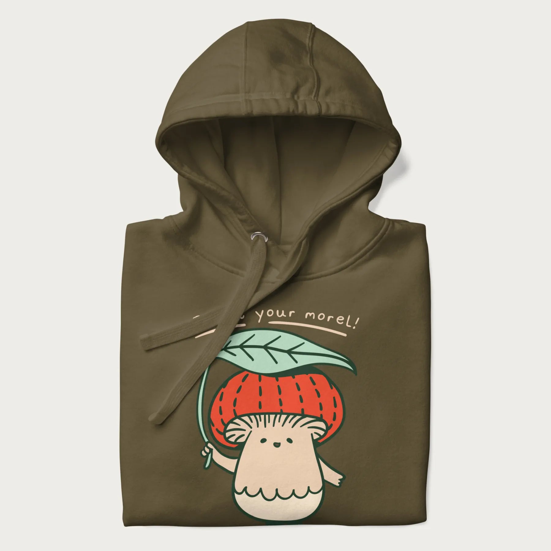 Folded military green hoodie with a graphic of an adorable mushroom character with a red cap and the text 'Boost your morel!'.