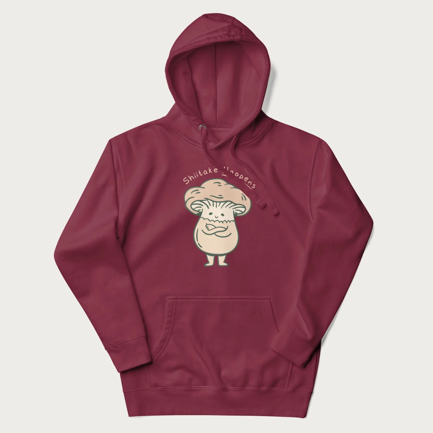 Maroon hoodie with a graphic of an adorable mushroom character and the text 'Shiitake Happens'.