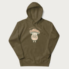 Military green hoodie with a graphic of an adorable mushroom character and the text 'Shiitake Happens'.