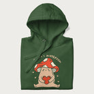 Folded forest green hoodie with a graphic of a mushroom character holding a heart and the text 'There's Mushroom in My Heart for You'.