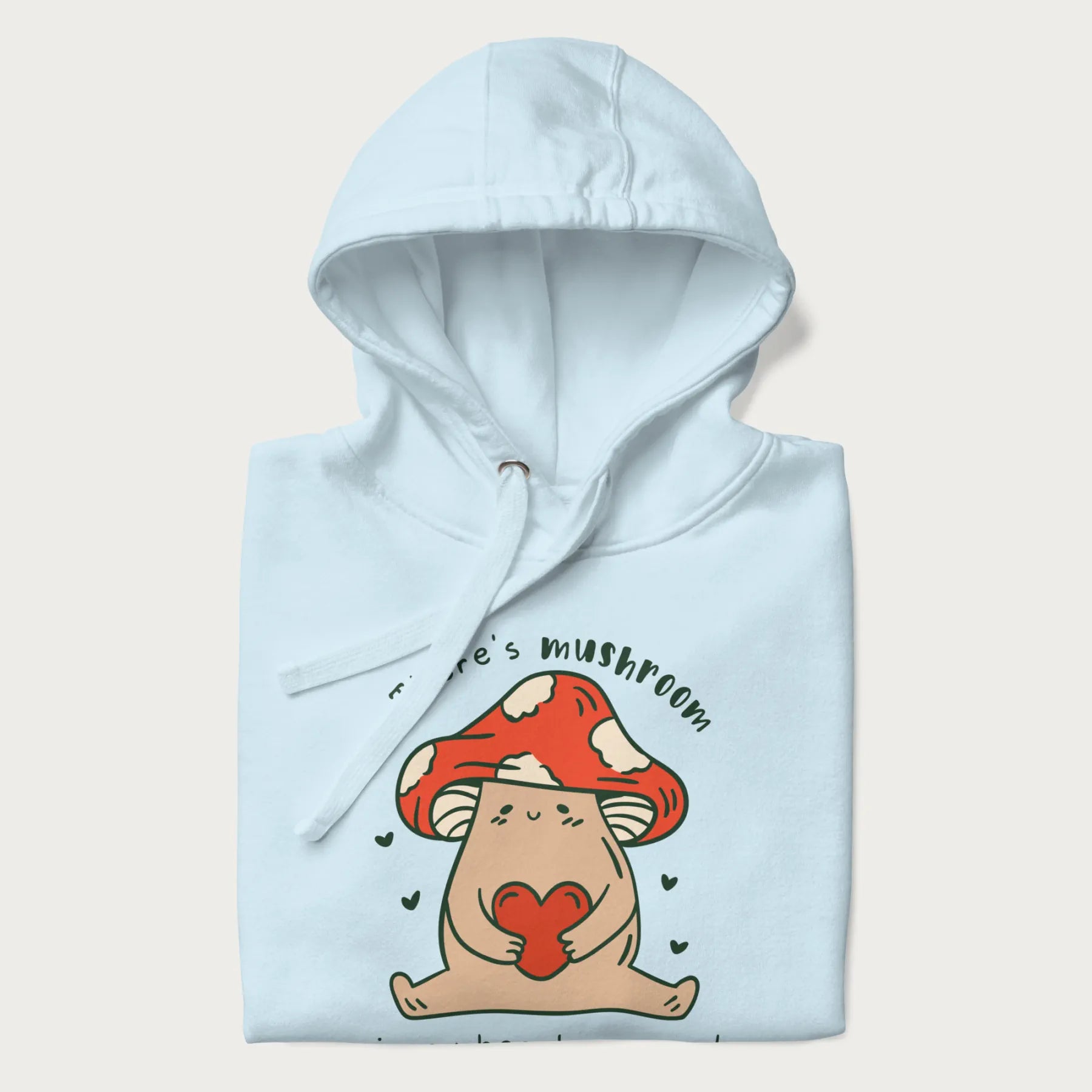 Folded light blue hoodie with a graphic of a mushroom character holding a heart and the text 'There's Mushroom in My Heart for You'.