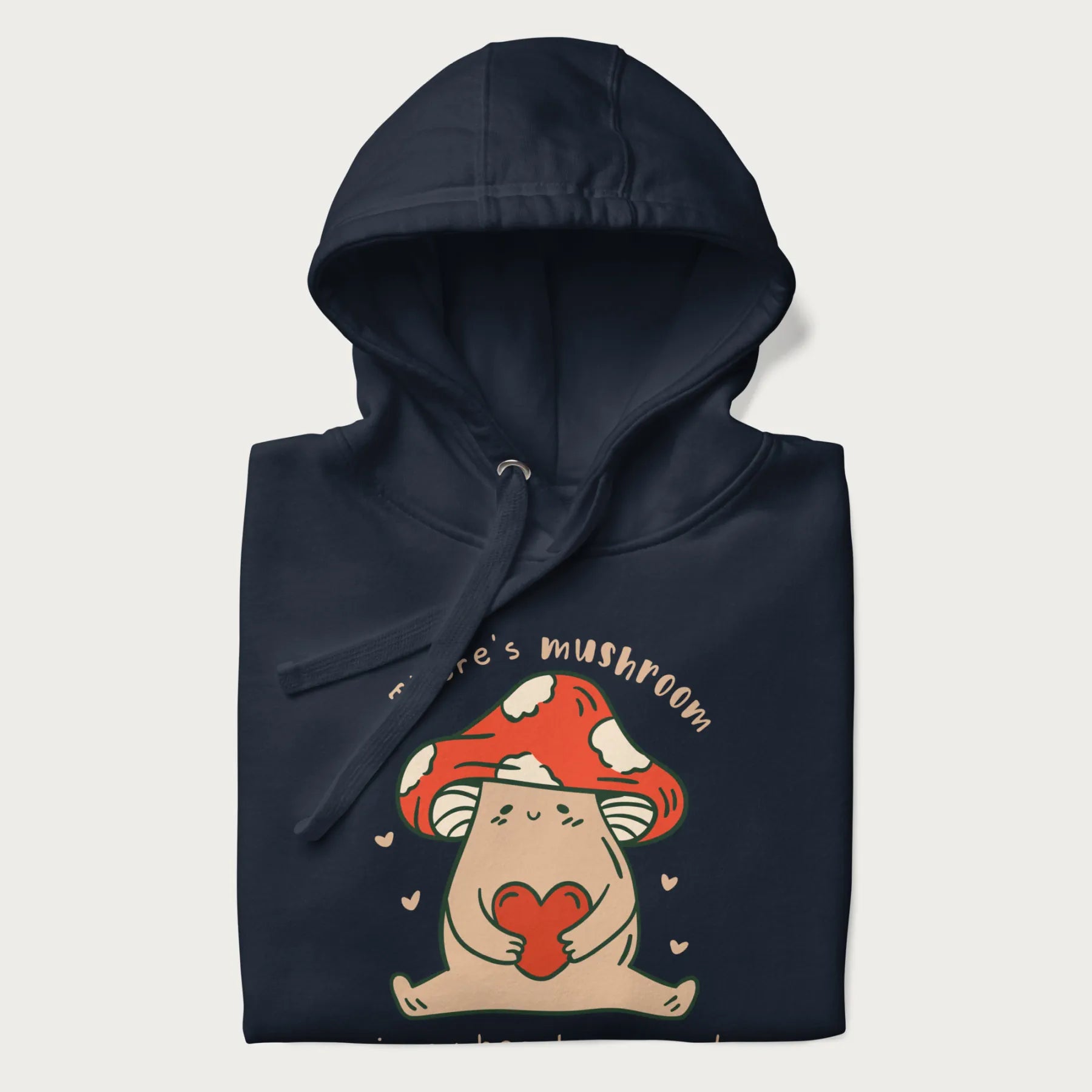 Folded navy blue hoodie with a graphic of a mushroom character holding a heart and the text 'There's Mushroom in My Heart for You'.