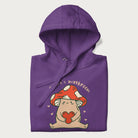 Folded purple hoodie with a graphic of a mushroom character holding a heart and the text 'There's Mushroom in My Heart for You'.